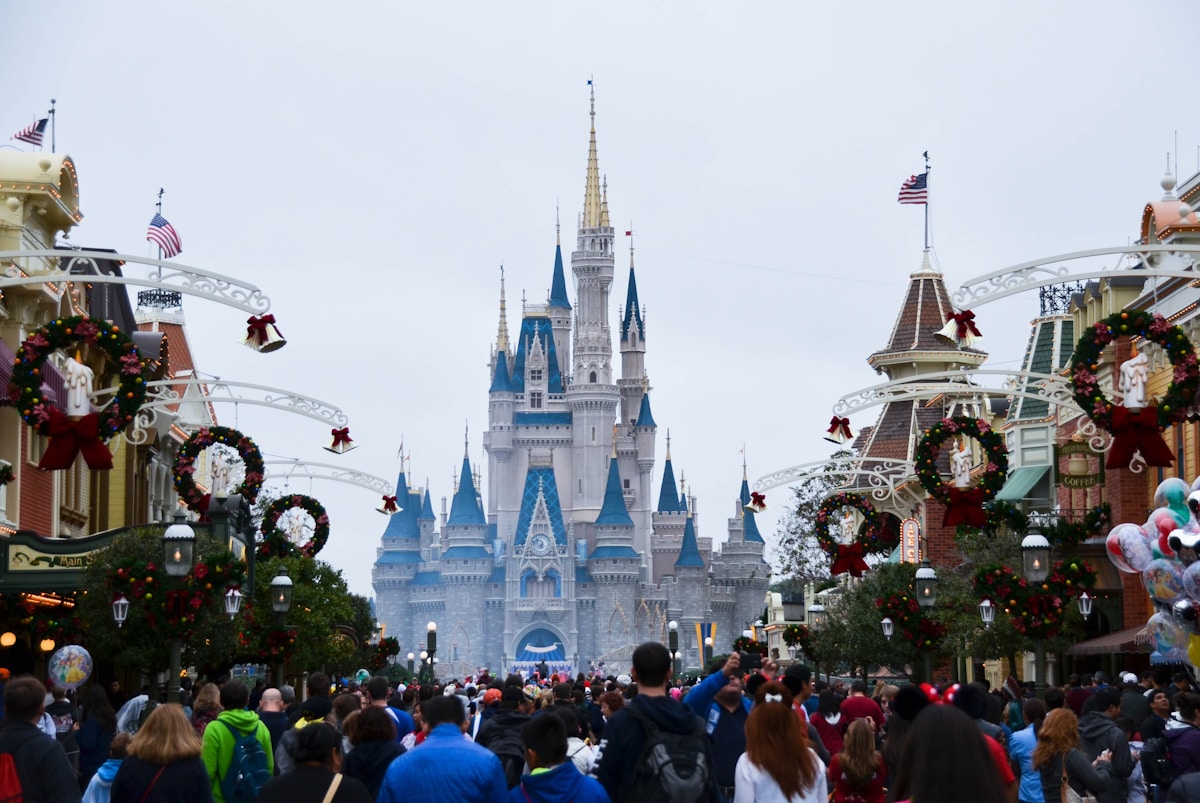Crowds on Main Street USA at Magic Kingdom with Cinderella Castle in the background